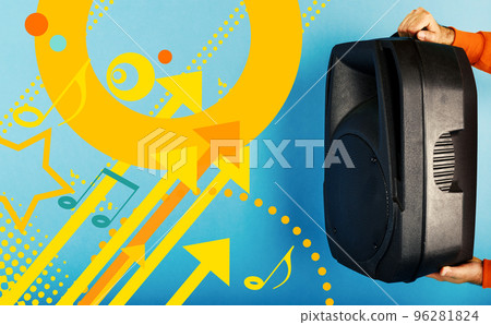 Man holds a big sound box to listen music. blue background Man holds a big sound box to listen music. blue background 96281824