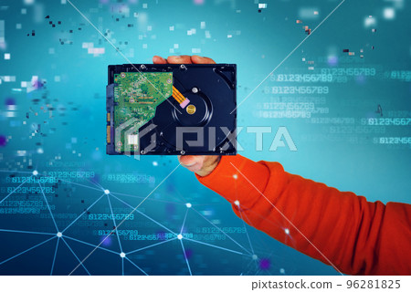 Man holds an hard disk. concept of storage and memory. cyan background 96281825