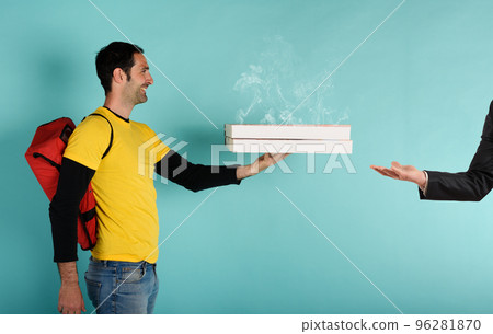 Deliveryman holds bizza boxes ready to be delivered . cyan background Deliveryman holds bizza boxes ready to be delivered . cyan background 96281870