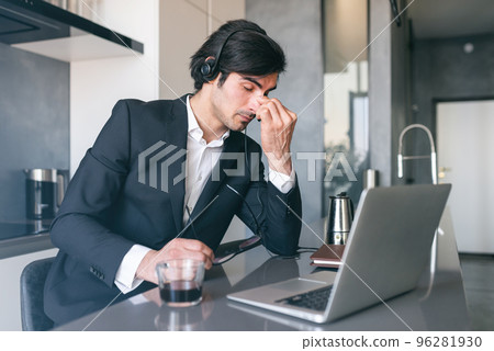 Stressed businessman with sight fatigue for display use 96281930