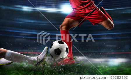 Close up of a football action scene with competing soccer players at the stadium 96282392