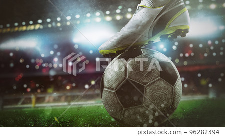 Close up of a soccer striker ready to kicks the ball at the stadium 96282394