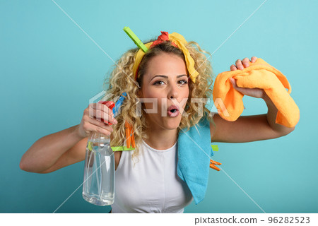 Funny housewife cleans and disinfects to keep germs, viruses and bacteria away. 96282523