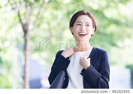 Business portrait of a woman walking outside 96282945