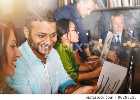 Team of people work together in office with company statistics. Concept of teamwork and partnership. 96283185