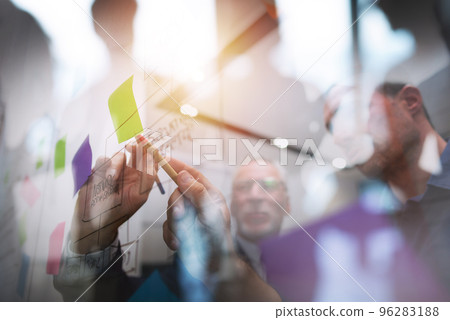 Business man draw a project with a pen. concept of teamwork, partnership and success 96283188