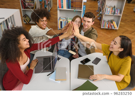University students are studying in a library together. Concept of teamwork and preparation 96283250