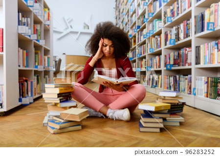 Tired university student has difficulty to study. Concept of stress, question and difficulty 96283252