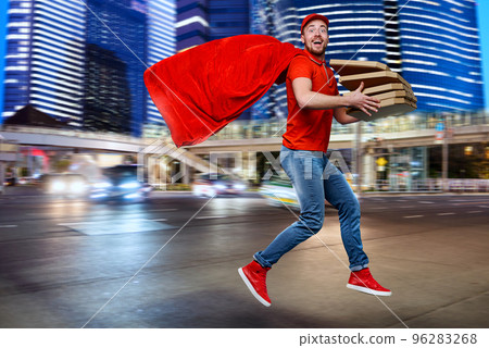 Deliveryman with pizzas acts like a powerful superhero. Concept of success and guarantee on shipment. Deliveryman with pizzas acts like a powerful superhero. Concept of success and guarantee on shipment. 96283268