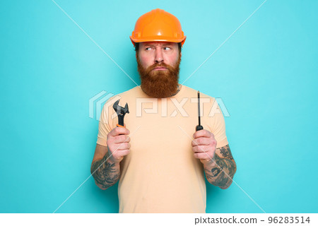 Worker is pensive about his work. concept of doubt and uncertainty. cyan background Worker is pensive about his work. concept of doubt and uncertainty. cyan background 96283514