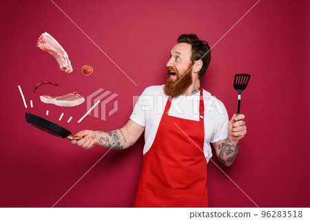 Happy chef cooks a new creative recipe. red background Happy chef cooks a new creative recipe. red background 96283518