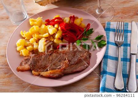 Beef entrecote with fried potato and baked sweet pepper Beef entrecote with fried potato and baked sweet pepper 96284111