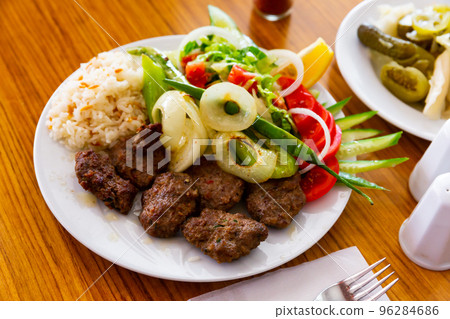 Turkish grilled veal kofte with rice and vegetables 96284686