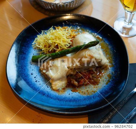 Cod fillet on vegetable ratatouille with chorizo, gratin Cod fillet on vegetable ratatouille with chorizo, gratin 96284702