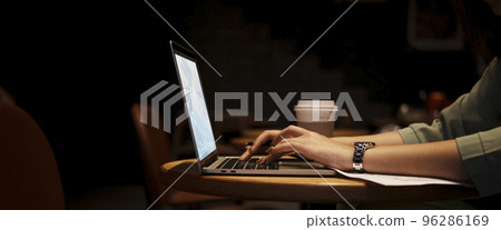 Close up hand asian woman holding pen in casual clothes working in cafe with laptop. Close up hand asian woman holding pen in casual clothes working in cafe with laptop. 96286169