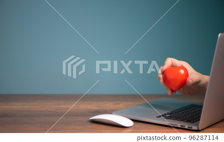 Red heart stick out of a laptop computer screen,  giving, donation, insurance, love chat online dating concept. 96287114