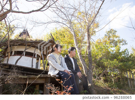 In front of a small hut in Shiki no Oka Park 96288065
