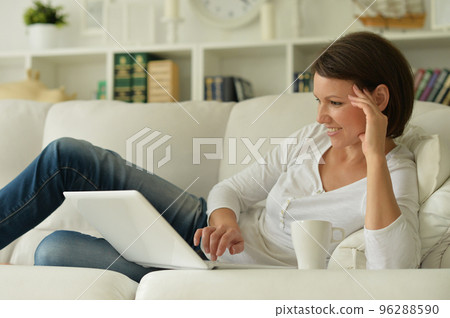 Cute young girl posing on a beautiful bed Cute young girl posing on a beautiful bed 96288590