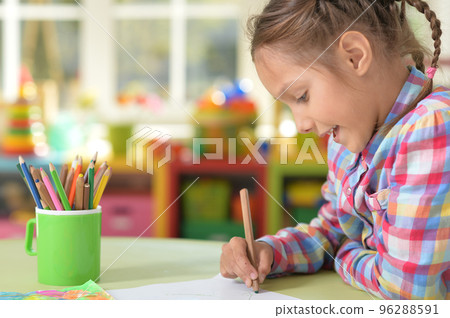 Cute little preschooler child drawing at home Cute little preschooler child drawing at home 96288591