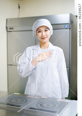 Young female cook (relief) Young female cook (relief) 96289627
