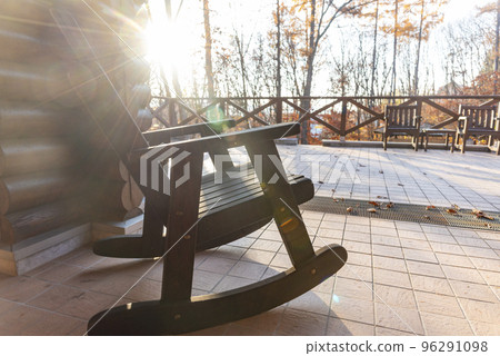 rocking chair on balcony 96291098