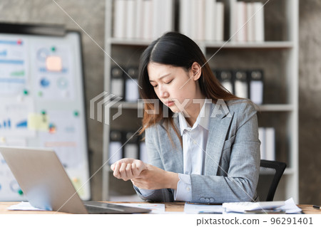 Stressed Asian business woman worry about marketing plan of this years. Account, Real Estate Agent, Finance concpet 96291401