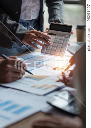 Business people brainstorming data target financial on financial document paperwork. business finance and discuss concept 96291407