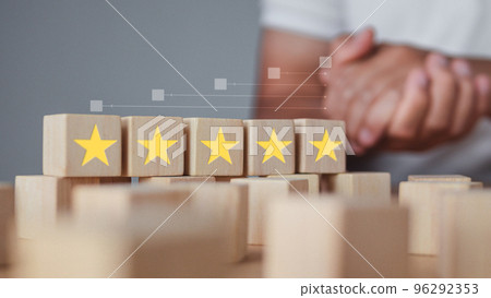 Welcome gesture of Receptionist. All wood blocks are five stars. It shows an excellent job and best service for customer. Evaluation and satisfaction concept. 96292353