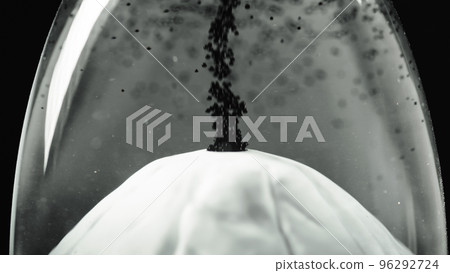 Miniature volcano erupting black lava 96292724