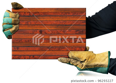 Carpenter with Work Gloves Holding a Brown Wooden Plank Carpenter with Work Gloves Holding a Brown Wooden Plank 96293227