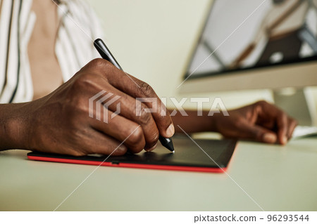 Hand of young African American designer of digital drawing Hand of young African American designer of digital drawing 96293544