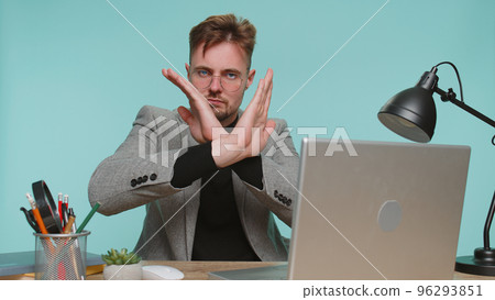 Business man at office say No hold palm folded crossed hands in stop gesture, warning of finish 96293851