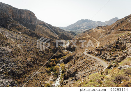 Hiking trail in a beautiful gorge for active walks in Greece on the island of Crete 96295134