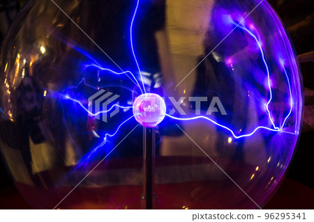 Plasma ball with smooth magenta-blue flames on a dark background. Plasma ball with smooth magenta-blue flames on a dark background. 96295341