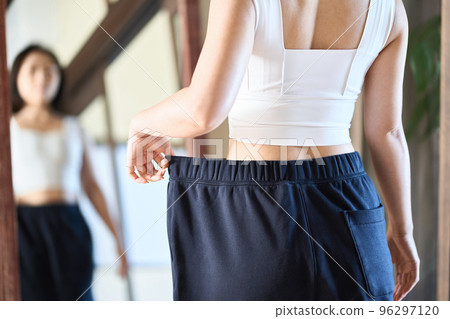 Asian woman checking diet results 96297120