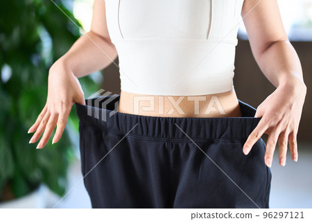 Asian woman checking diet results Asian woman checking diet results 96297121