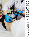 Cavitation massage to reduce subcutaneous fat in the spa. 96297906