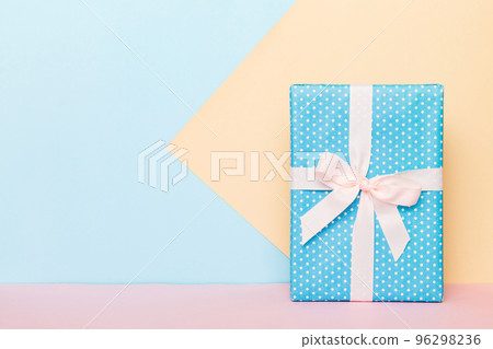 holiday handmade paper present tied white ribbon bow top view with copy space. Flat lay holiday background. Birthday or christmas present. Christmas gift box concept with copy space holiday handmade paper present tied white ribbon bow top view with copy space. Flat lay holiday background. Birthday or christmas present. Christmas gift box concept with copy space 96298236
