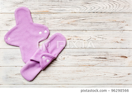 Eco-friendly reusable fabric women's pads. set of colorful bright reusable menstrual pads. zero waste woman periods concept top view with copy space Eco-friendly reusable fabric women's pads. set of colorful bright reusable menstrual pads. zero waste woman periods concept top view with copy space 96298566