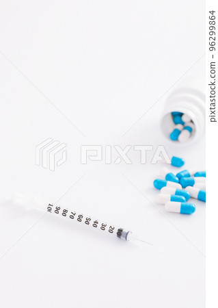 Syringe and pill isolated in white background 96299864