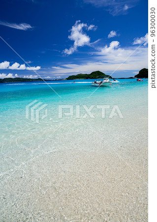 A boat floating on the beach of Zamami Island A boat floating on the beach of Zamami Island 96300030