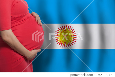 Pregnant woman belly on Argentine flag background Pregnant woman belly on Argentine flag background 96300048