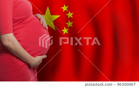 Pregnant woman belly on Chinese flag background Pregnant woman belly on Chinese flag background 96300067