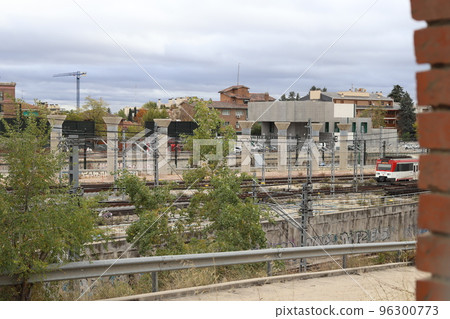Train. Train tracks. Train entering a station. Subway leaving the station. Means of transport in Madrid, in Spain. Horizontal photography. Train. Train tracks. Train entering a station. Subway leaving the station. Means of transport in Madrid, in Spain. Horizontal photography. 96300773