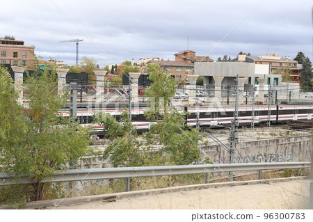 Train. Train tracks. Train entering a station. Subway leaving the station. Means of transport in Madrid, in Spain. Horizontal photography. Train. Train tracks. Train entering a station. Subway leaving the station. Means of transport in Madrid, in Spain. Horizontal photography. 96300783