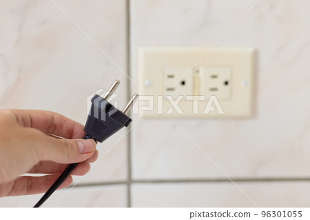 Power cable doesnt feet to the electrical plug type B. Selective focus. Power cable doesnt feet to the electrical plug type B. Selective focus. 96301055