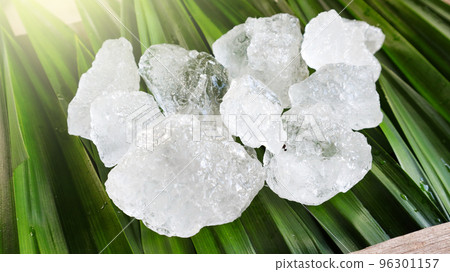 Crystal clear alum cubes or Potassium alum on green leaf Chemical compound substance Concept for beauty spa and underarm treatment industrial                       96301157