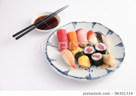 Sushi Set nigiri and sushi rolls with soy sauce and chopsticks Japanese food isolated in white background Sushi Set nigiri and sushi rolls with soy sauce and chopsticks Japanese food isolated in white background 96301334