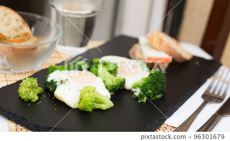 breakfast of crumpled eggs with broccoli breakfast of crumpled eggs with broccoli 96301679