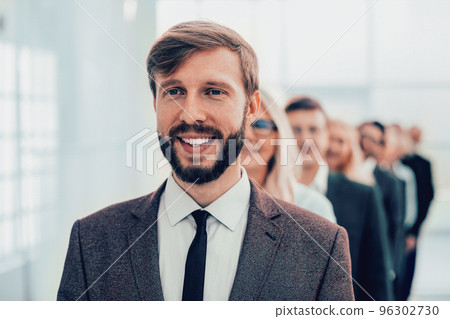 close up. group of happy employees standing in the office. close up. group of happy employees standing in the office. 96302730